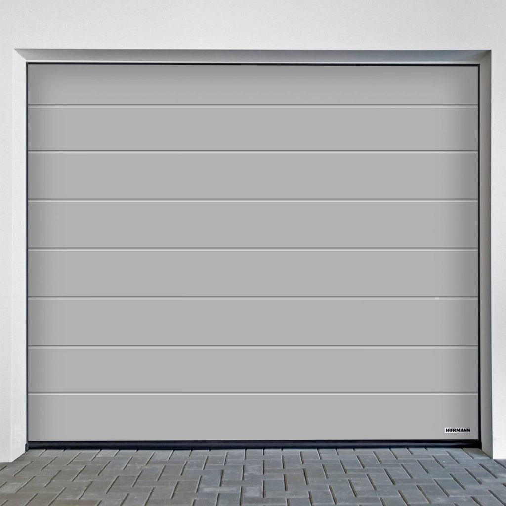 Sectional door Hörmann RenoMatic M-Ribbed Planar in sleek grey finish, perfect for modern garage renovations.