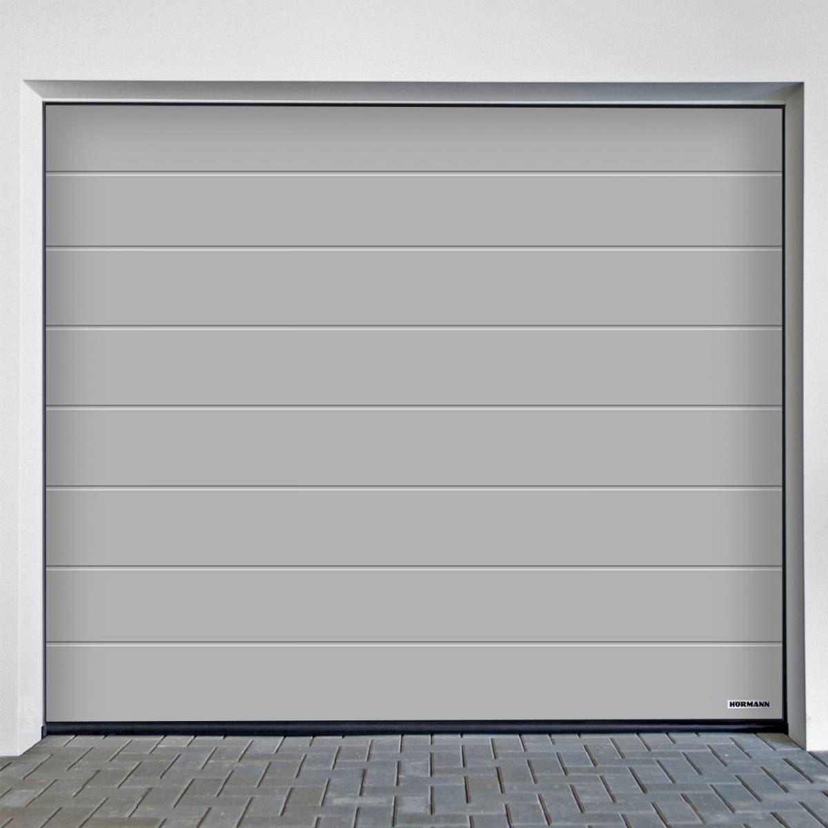 Sectional door Hörmann RenoMatic M-Ribbed Planar in sleek grey finish, perfect for modern garage renovations.