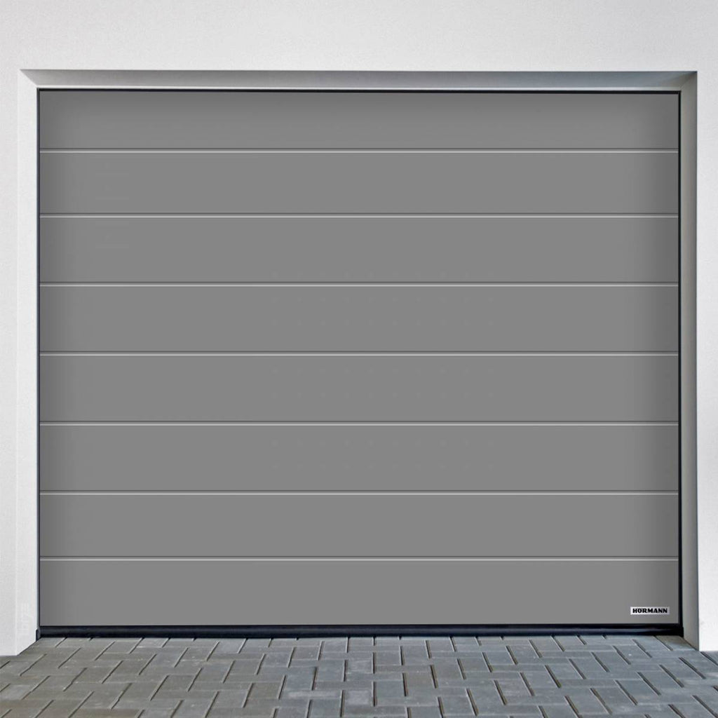 Puerta seccional Hörmann RenoMatic Acanalado M Planar con diseño moderno y acabado en color gris.