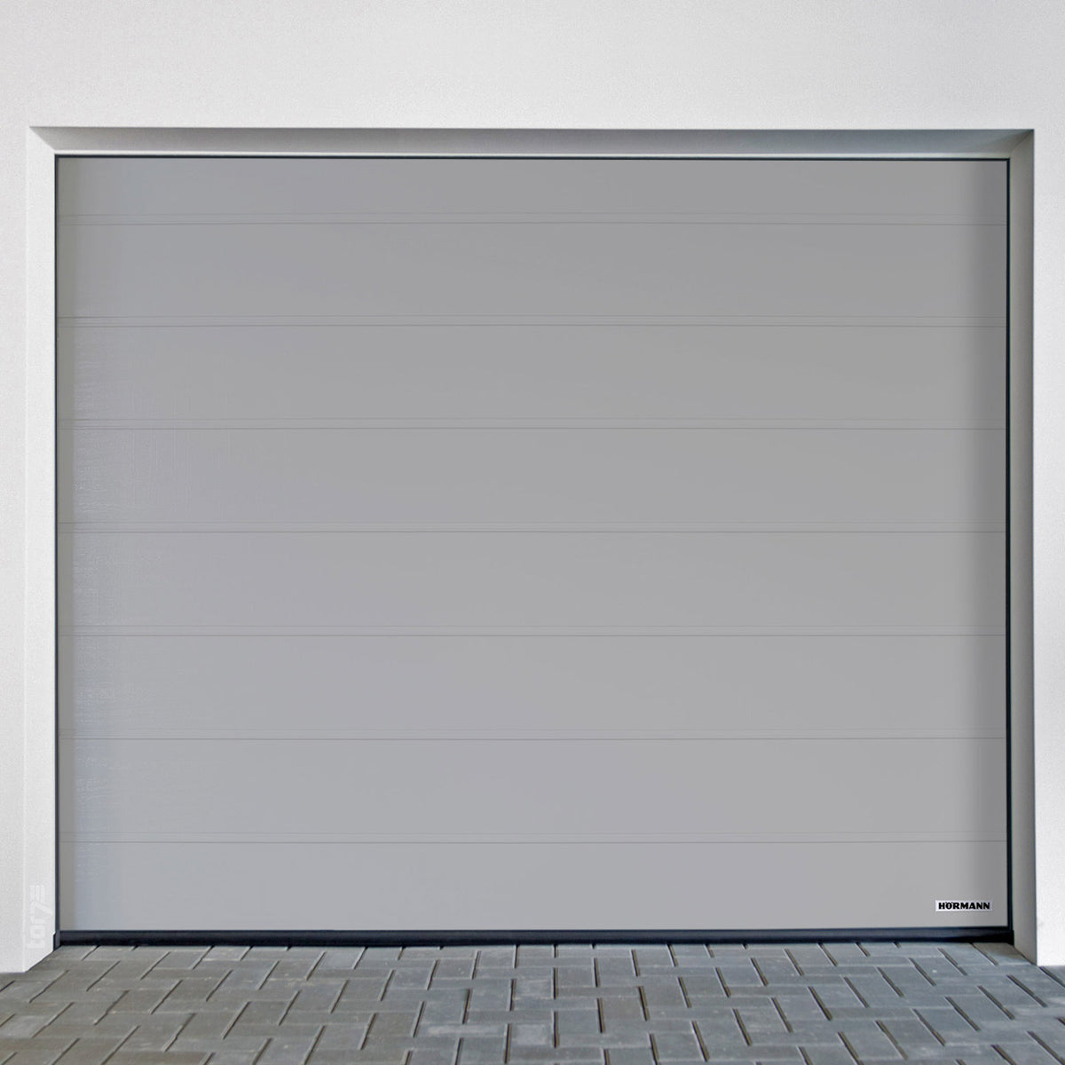 Garage door Hörmann RenoMatic in a sleek grey design showcasing modern style and durability.
